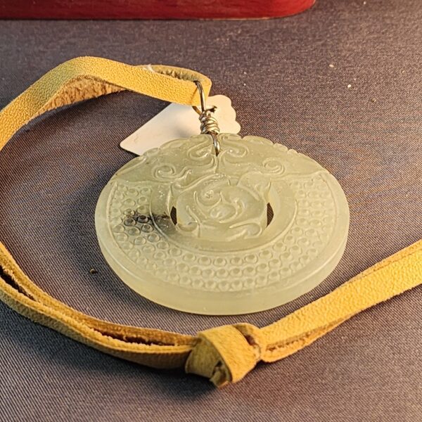 Carved stone ornament with leather cord - Image 2